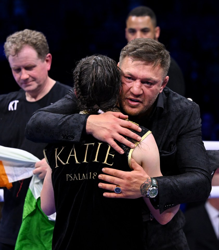 Katie Taylor consoled after defeat by Conor McGregor