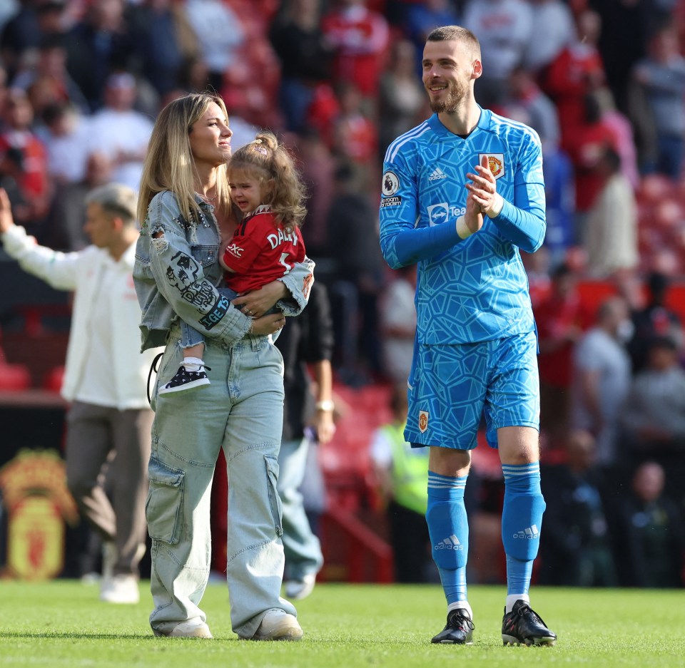 The De Geas walk on the Old Trafford pitch after the final game of the season