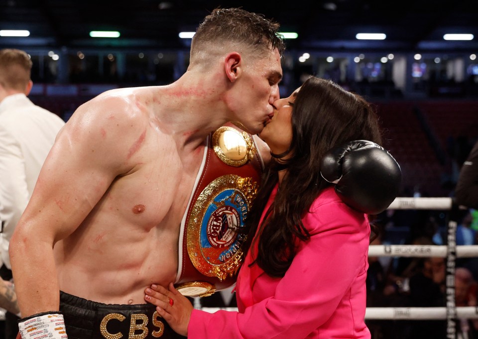 The new champ celebrates with wife Mia