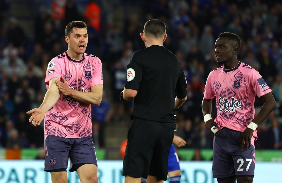 He bizarrely protested to Michael Oliver by pointing to his arm below the t-shirt line