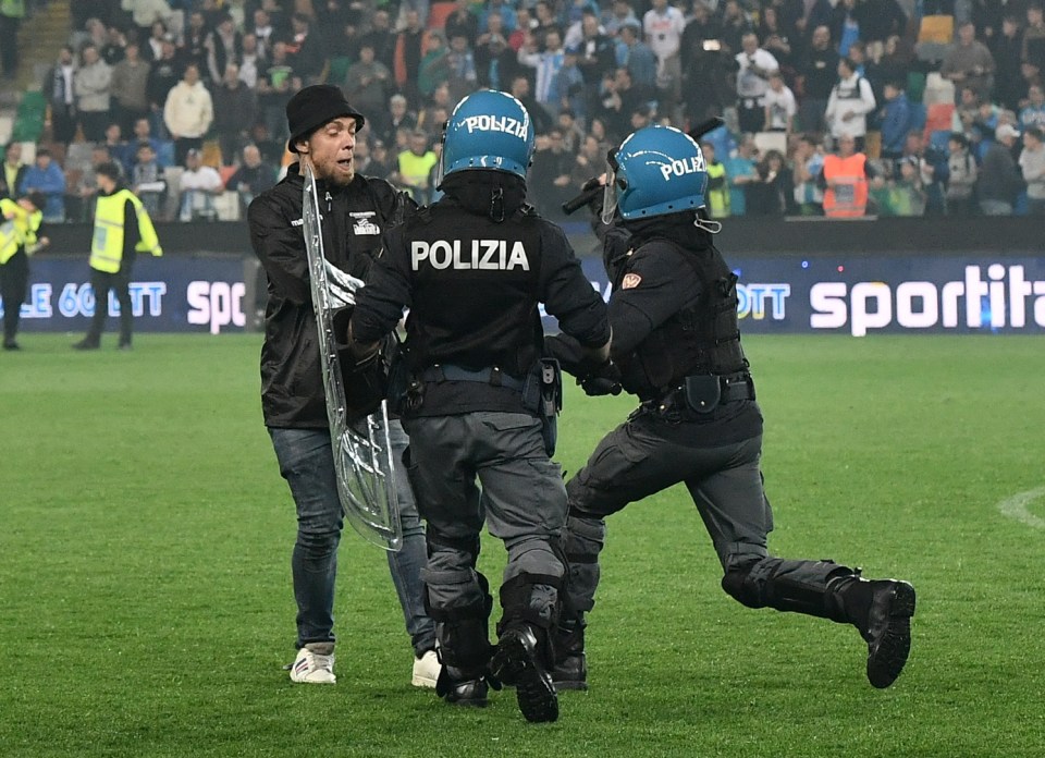 Police clashed with fans at full-time as fans came onto the field