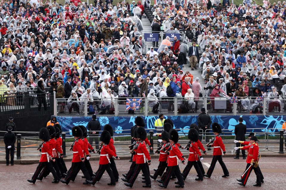 Royal fans tried to keep dry yesterday as the coronation took place in London