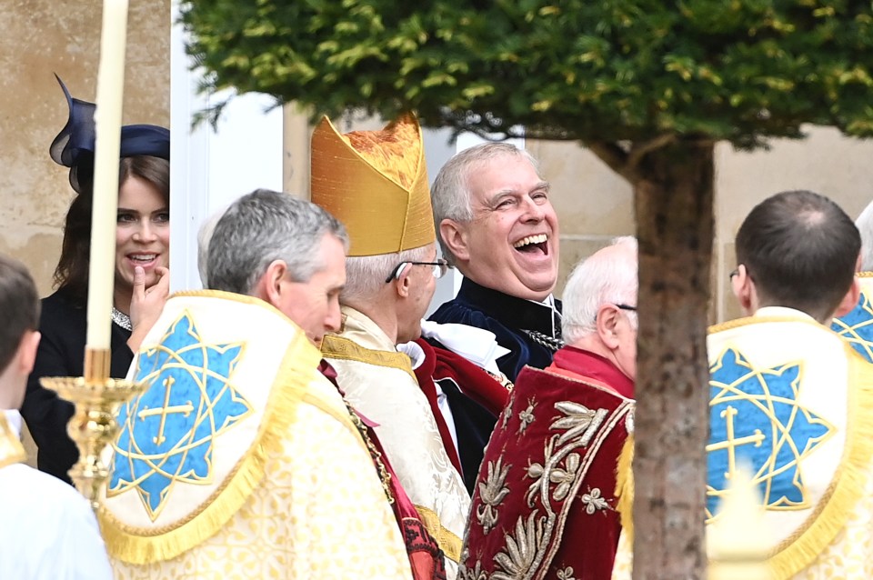 Prince Andrew laughs as he leaves the service