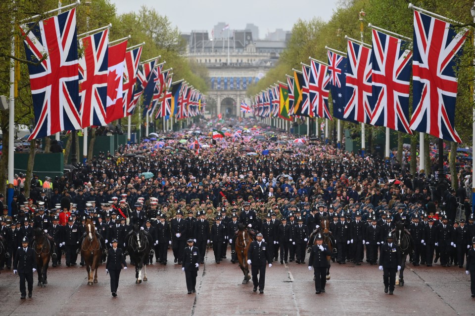 A mile-long military procession followed the royals from Westminster Abbey to Buckingham Palace