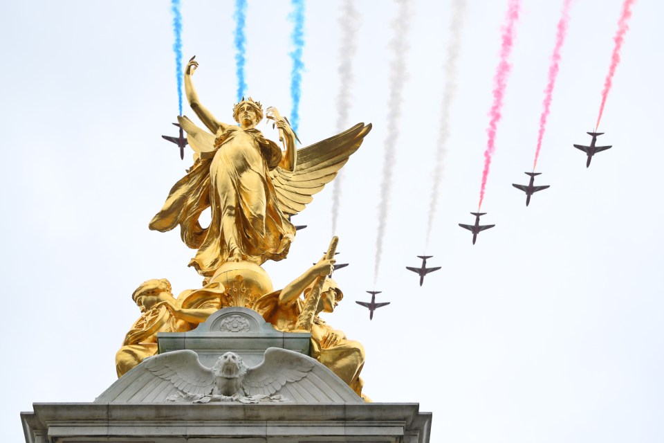 The acrobatics team soared over Buckingham Palace in tight formation