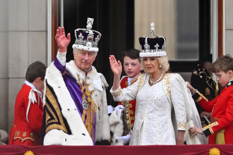 King Charles and Queen Camilla wave from the Buckingham Palace balcony