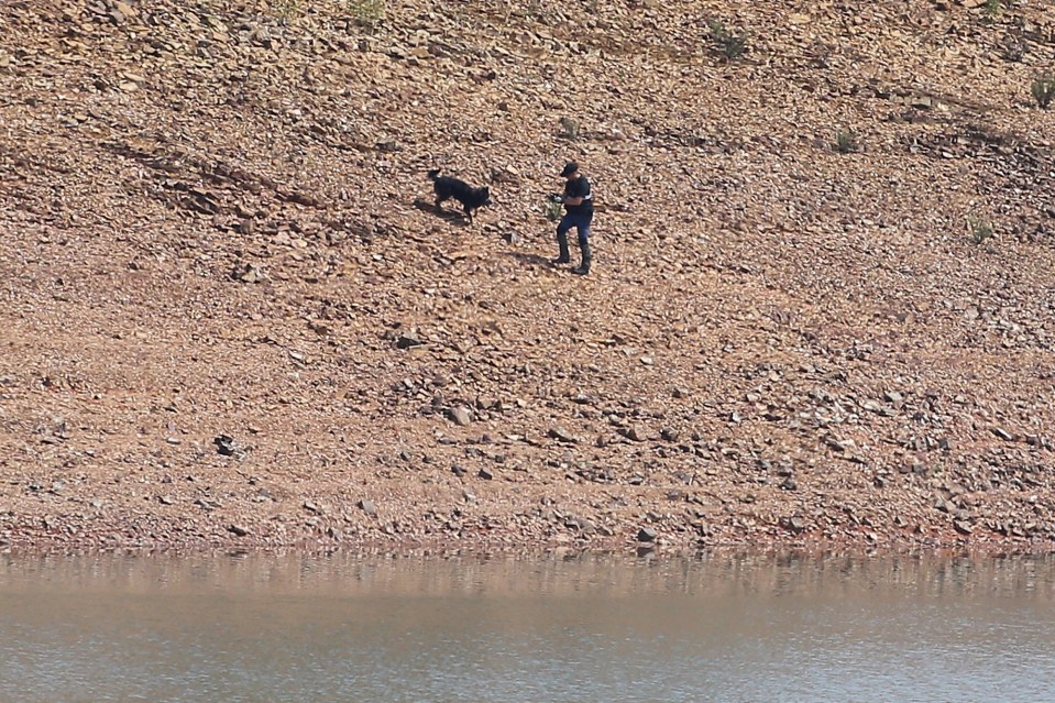 Cops were seen scouring the banks of the reservoir for evidence on Monday