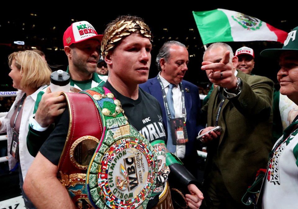 Canelo Alvarez with his super-middleweight titles