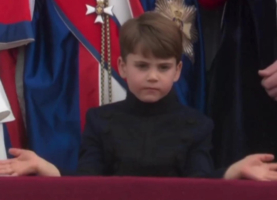 After banging his fists on the balcony, the not-smiling prince waved his hands slowly like window wipers