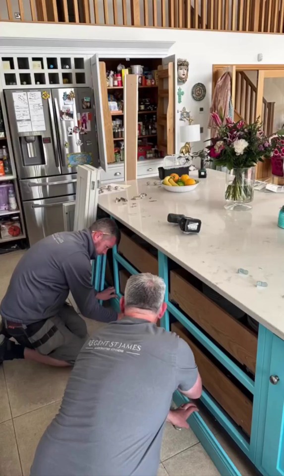 She shared a video showing workmen taking apart her kitchen island