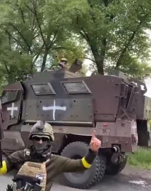 Social media videos appeared to show soldiers and their armoured vehicles