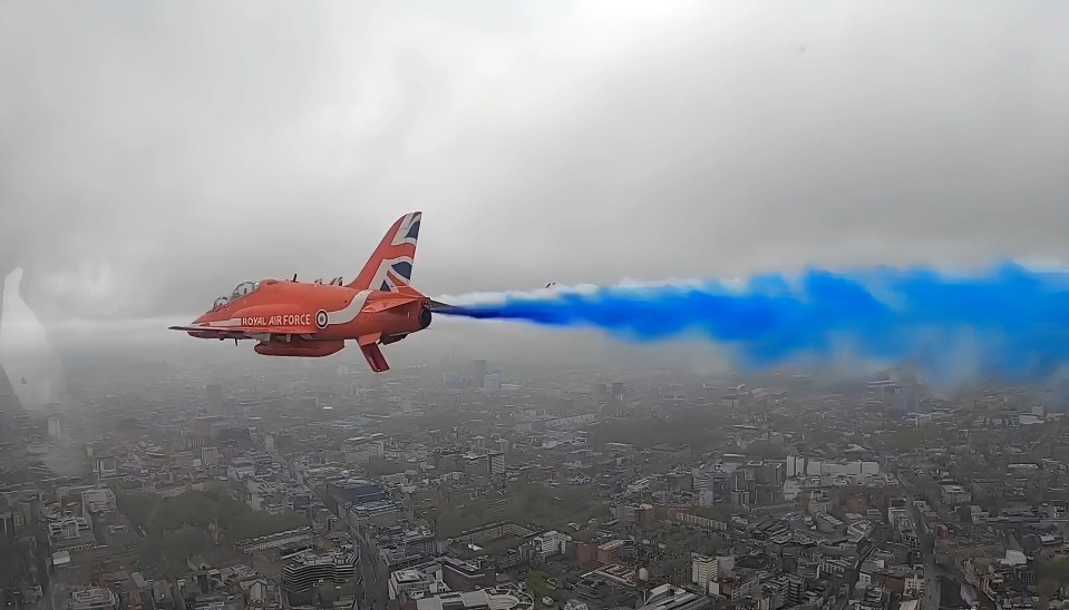 Footage from inside the cockpit shows the jets as they leave a multicoloured trail