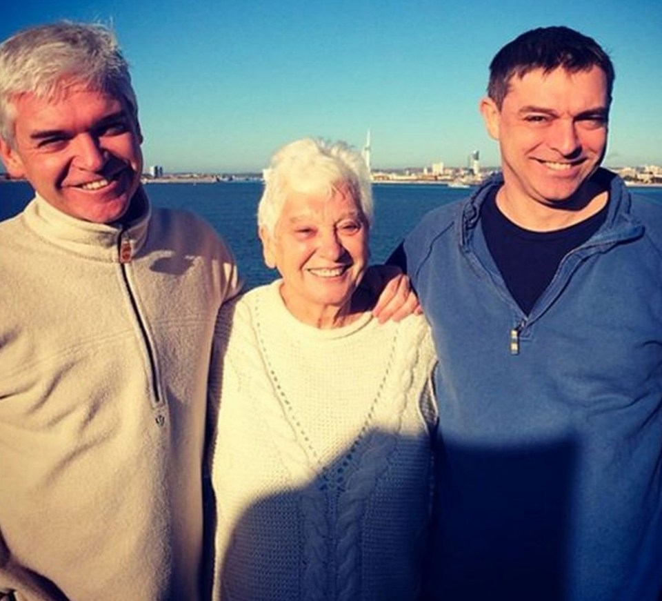 Phillip Schofield, pictured with his mum and Timothy, has disowned his brother