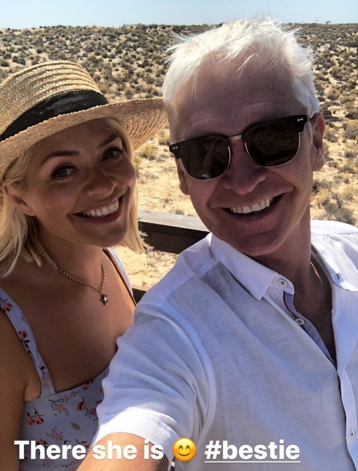 Best friends Holly and Phil share a laugh on a beach in 2019