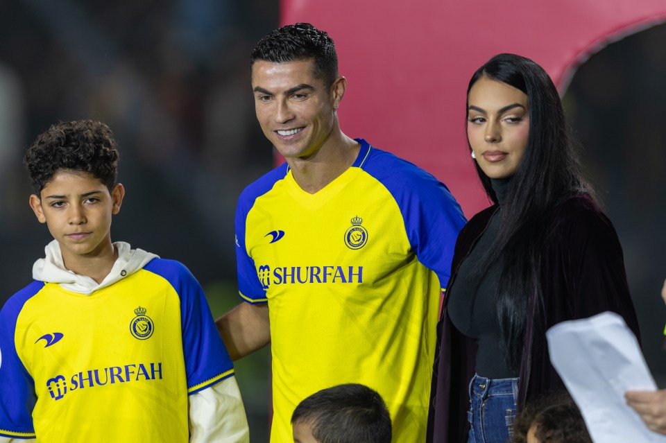 RIYADH, SAUDI ARABIA - JANUARY 03: Cristiano Ronaldo accompanied by his partner Georgina Rodriguez and his son Cristiano Ronaldo Jr, greet the crowd during the official unveiling of Cristiano Ronaldo as an Al Nassr player at Mrsool Park Stadium on January 3, 2023 in Riyadh, Saudi Arabia. (Photo by Yasser Bakhsh/Getty Images)