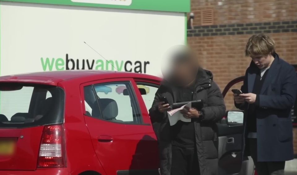 PIC FROM Kennedy News/Josh & Archie (PICTURED: JOSH PIETERS AND ARCHIE MANNERS, BOTH 29, DISCUSSING THE SALE OF THE 'CRIME CAR' WITH THE WE BUY ANY CAR WORKER) Pranksters keen to test if We Buy Any Car live up to their name were left stunned when they pretended to be gangsters and turned their hatchback into a 'crime scene' - yet the motor firm still bought it. Josh Pieters and Archie Manners, both 29, smeared fake blood over a Kia Picanto and filled the boot with rope, cable ties and even Archie's real hair. A viral video shows the visibly nervous pair parking their vehicle at We Buy Any Car's Putney branch, South London, and telling the worker they 'need to get rid of it quickly'. DISCLAIMER: While Kennedy News and Media uses its best endeavours to establish the copyright and authenticity of all pictures supplied, it accepts no liability for any damage, loss or legal action caused by the use of images supplied and the publication of images is solely at your discretion. SEE KENNEDY NEWS COPY - 0161 697 4266