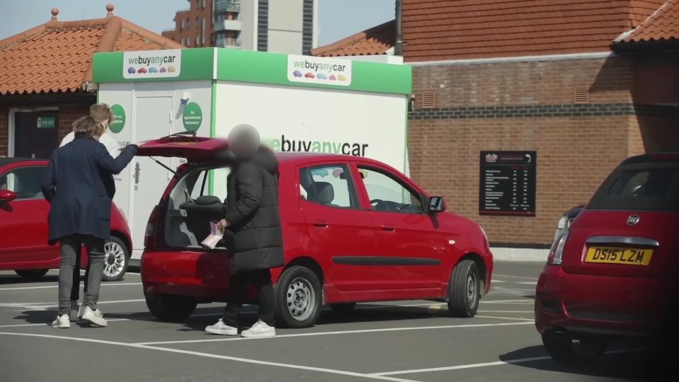 PIC FROM Kennedy News/Josh & Archie (PICTURED: THE WE BUY ANY CAR WORKER LOOKING INTO THE BOOT WHICH THE PRNKSTERS FAKE CRIME SCENE EVIDENCE ) Pranksters keen to test if We Buy Any Car live up to their name were left stunned when they pretended to be gangsters and turned their hatchback into a 'crime scene' - yet the motor firm still bought it. Josh Pieters and Archie Manners, both 29, smeared fake blood over a Kia Picanto and filled the boot with rope, cable ties and even Archie's real hair. A viral video shows the visibly nervous pair parking their vehicle at We Buy Any Car's Putney branch, South London, and telling the worker they 'need to get rid of it quickly'. DISCLAIMER: While Kennedy News and Media uses its best endeavours to establish the copyright and authenticity of all pictures supplied, it accepts no liability for any damage, loss or legal action caused by the use of images supplied and the publication of images is solely at your discretion. SEE KENNEDY NEWS COPY - 0161 697 4266