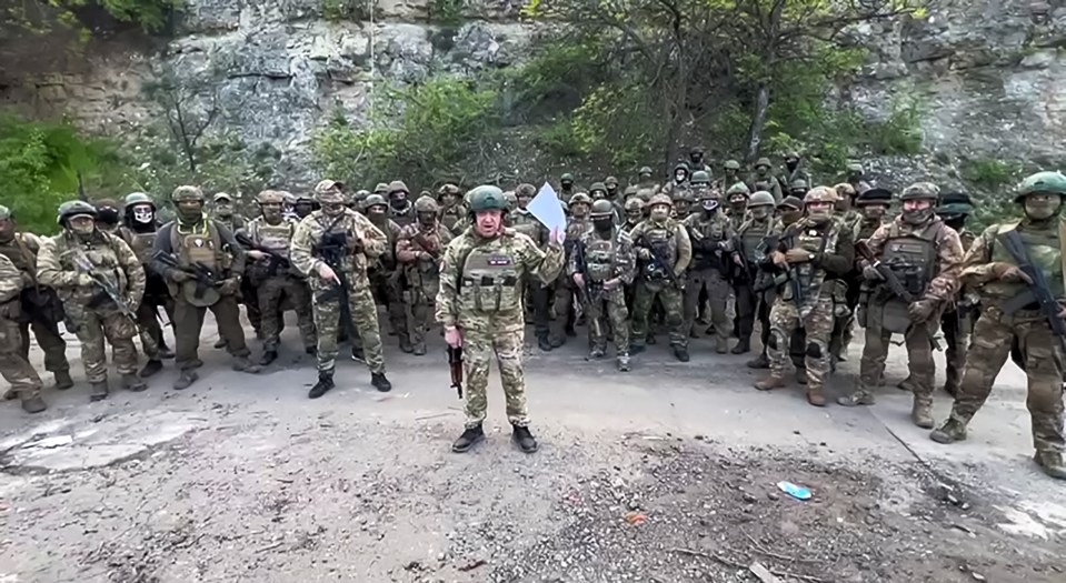 This video grab taken from a handout footage posted on May 5, 2023 on the Telegram account of the press-service of Concord -- a company linked to the chief of Russian mercenary group Wagner, Yevgeny Prigozhin -- shows Yevgeny Prigozhin addressing the Russian army's top brass standing in front of Wagner fighters at an undisclosed location. - The head of Russian paramilitary group Wagner on Friday threatened to pull his fighters from the front line in Bakhmut in eastern Ukraine on May 10, saying ammunition shortages meant they faced "senseless death". "On May 10, 2023 we will have to hand over our positions in Bakhmut to units of the defence ministry and withdraw Wagner units to rear camps to lick our wounds," Yevgeny Prigozhin said in a written statement on his Telegram channel. (Photo by Handout / TELEGRAM/ @concordgroup_official / AFP) / RESTRICTED TO EDITORIAL USE - MANDATORY CREDIT "AFP PHOTO / Telegram channel of Concord group" - NO MARKETING - NO ADVERTISING CAMPAIGNS - DISTRIBUTED AS A SERVICE TO CLIENTS (Photo by HANDOUT/TELEGRAM/ @concordgroup_official/AFP via Getty Images)