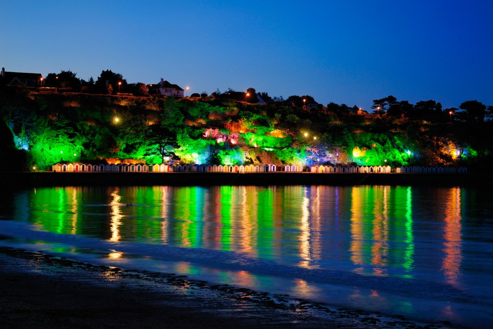 Gorgeous lights shine upon the ocean after dusk