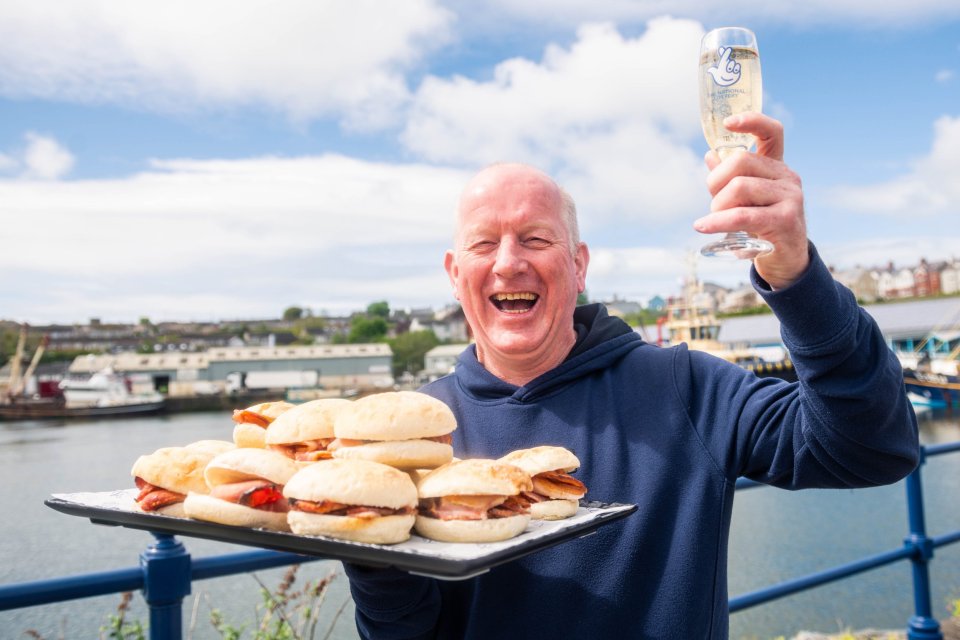 Paul Bevans celebrates his Set For Life win with fizz and bacon butties