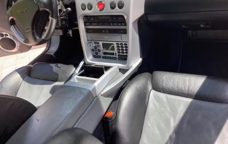 The Vanquish's interior includes lots of black leather and silver trim