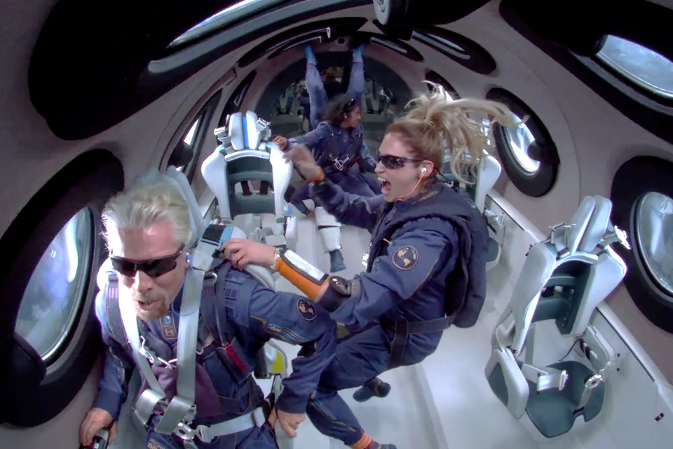 Crew members Beth Moses and Sirisha Bandla float in zero gravity after reaching the edge of space in July 2021