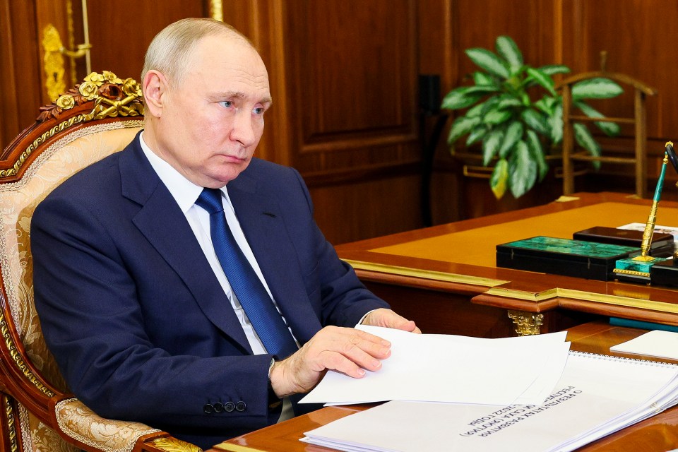 Russian President Vladimir Putin listens to the head of the Republic of Sakha (Yakutia), Aisen Nikolayev, during their meeting at the Kremlin in Moscow, Russia, Monday, May 29, 2023. (Gavriil Grigorov, Sputnik, Kremlin Pool Photo via AP)