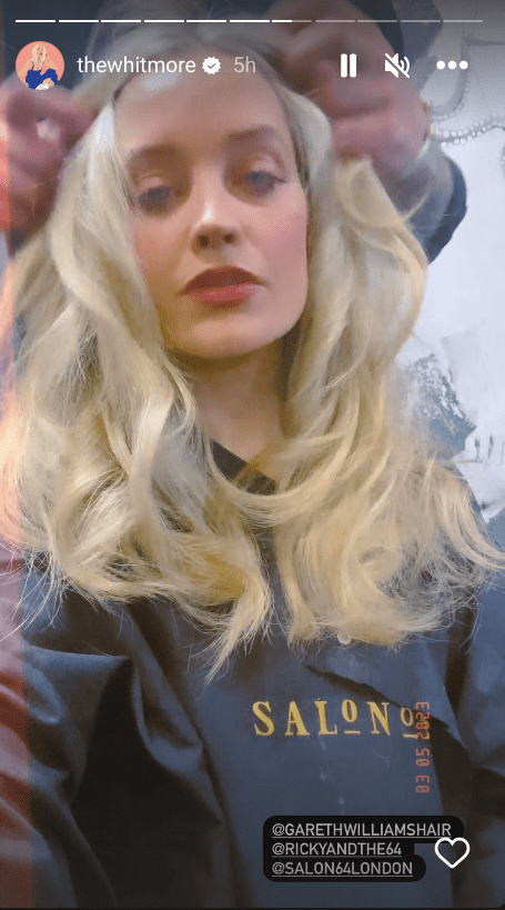 Laura had her locks blown out into glam waves