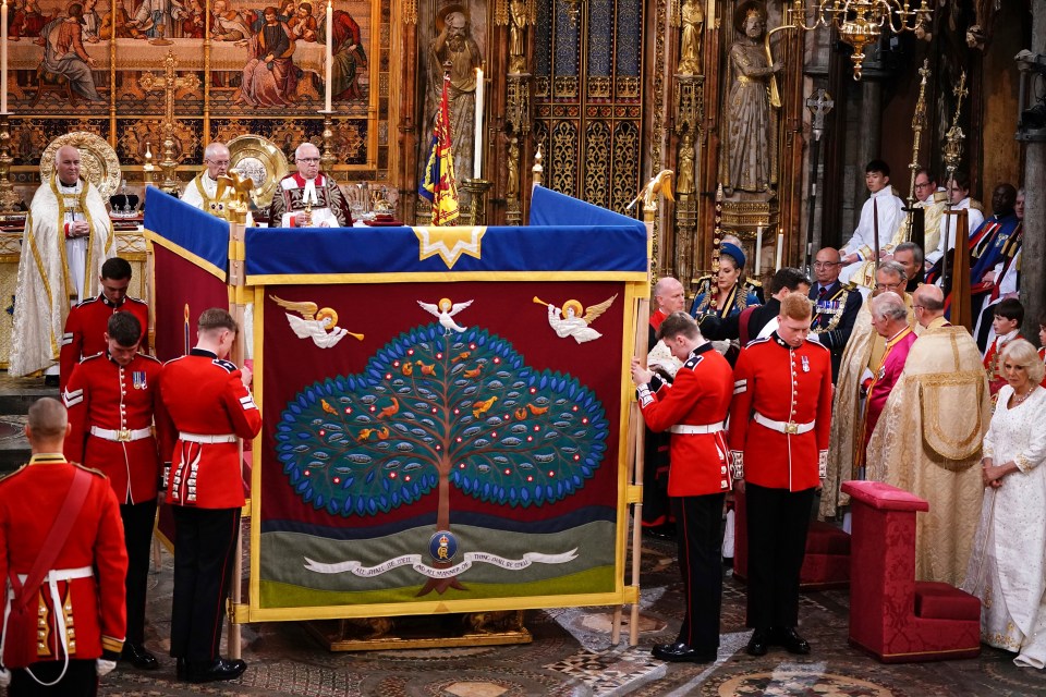 Shielded from view, holy oil was then poured for the Archbishop of Canterbury to anoint King Charles on his 'hand, breast and head'