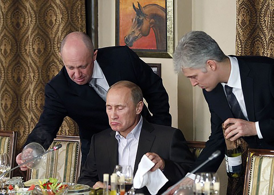 Prigozhin serves Putin his dinner during a meeting in 2011