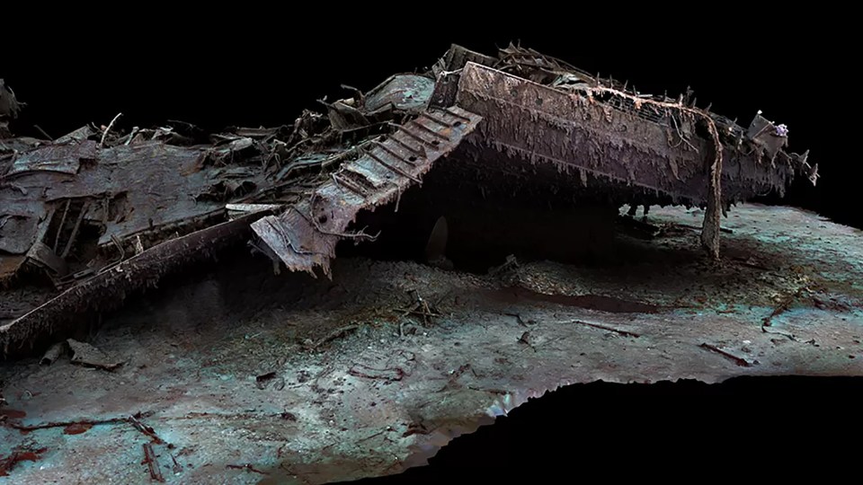 The ship's vast bow collapsing onto the sea floor