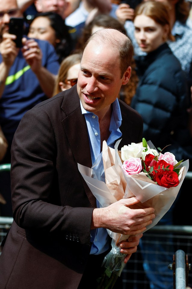 The Prince was handed a beautiful bouquet while greeting royal fans