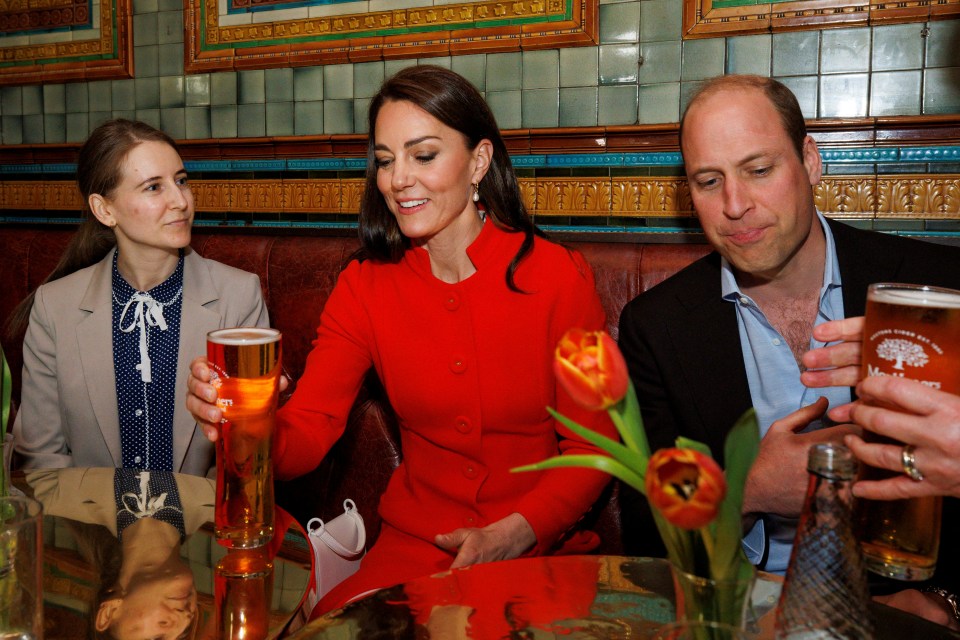 The couple were served a pint of cider by Bernie Kidson (not pictured) as they chat to local people