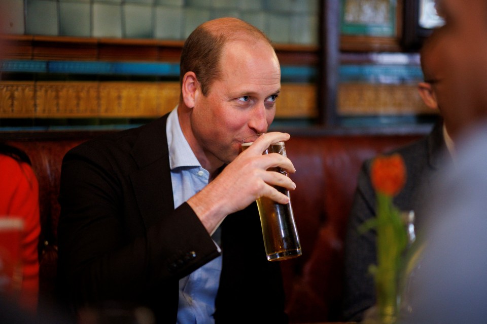 William drinks cider as he chats to local business people inside the Dog and Duck pub