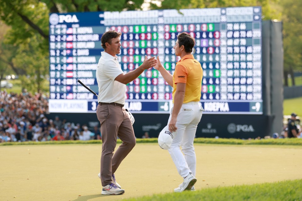 Koepka and runner-up Viktor Hovland  shake hands on the 18th green after the American wins