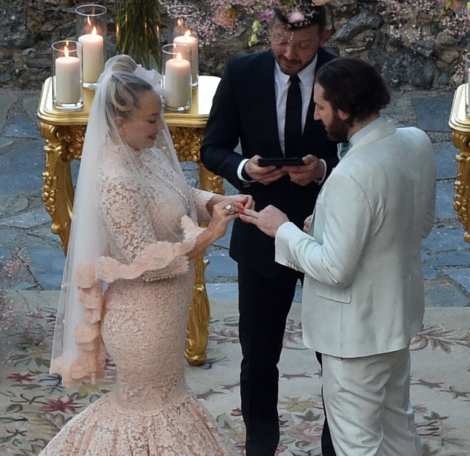 The happy couple exchange rings during the intimate ceremony