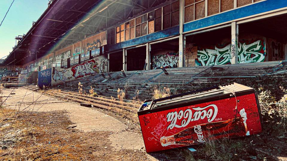 An empty fridge next to old stands at Brandon Stadium in Coventry