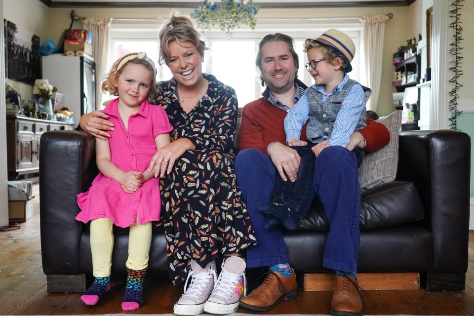 Clara and her husband Adam at home with their kids