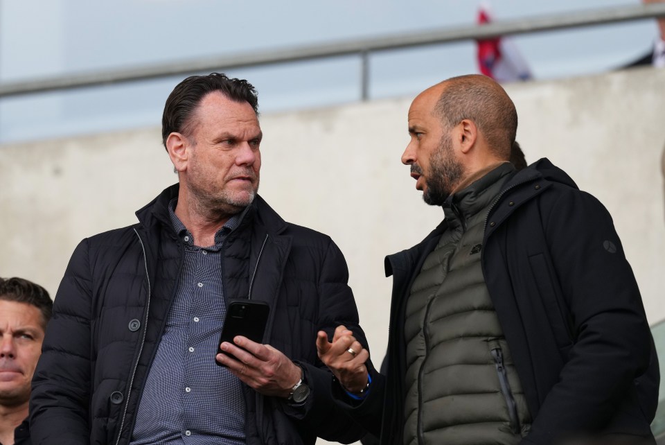 The families of AZ Alkmaar general manager Robert Eenhoorn, left, and manager Pascal Jansen, right, were allegedly confronted by West Ham fans