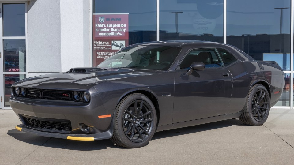 Cincinnati - Circa February 2023: Dodge Challenger display. Dodge offers the Challenger in SXT, GT, R/T, and SRT Hellcat models.