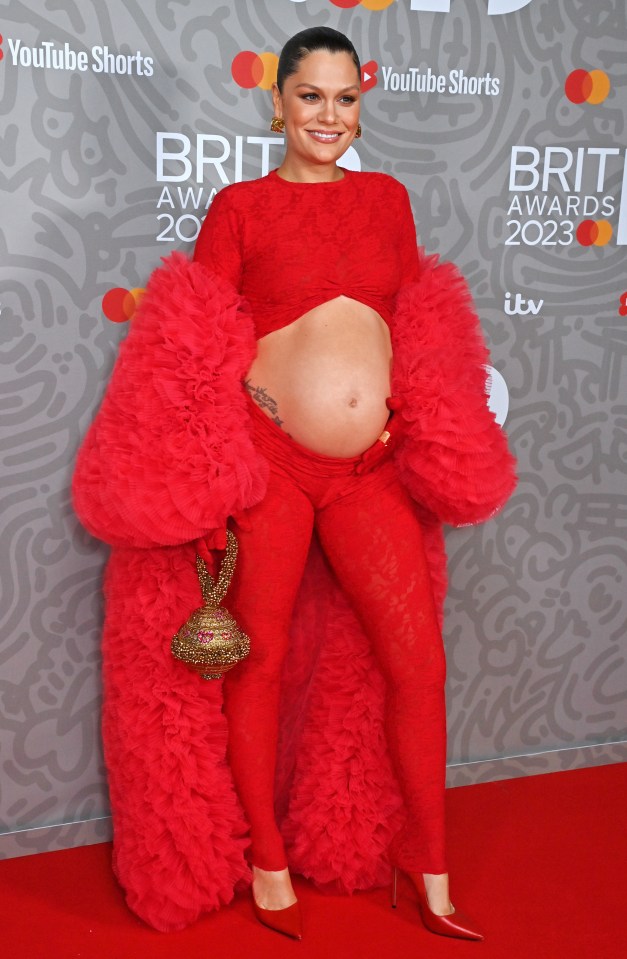 She showed off her growing baby bump at the Brits in February