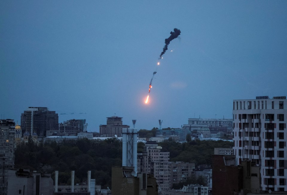 An explosion of a drone is seen in the sky over Kyiv