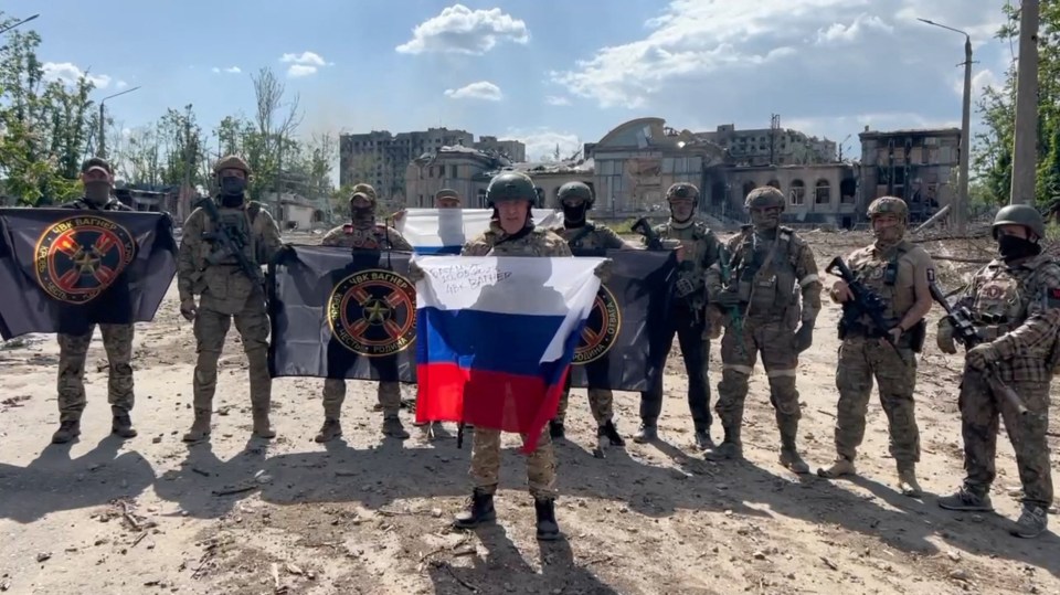 Prigozhin waves a Russian flag as he claimed to have taken control of Bakhmut