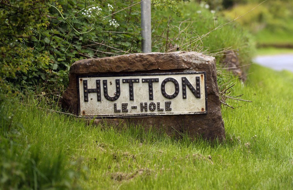 A signs welcomes visitors to the idyllic village