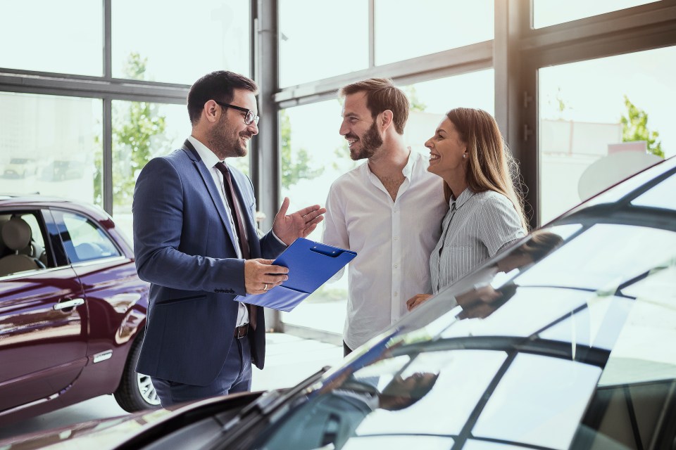 Car salesman making a sale