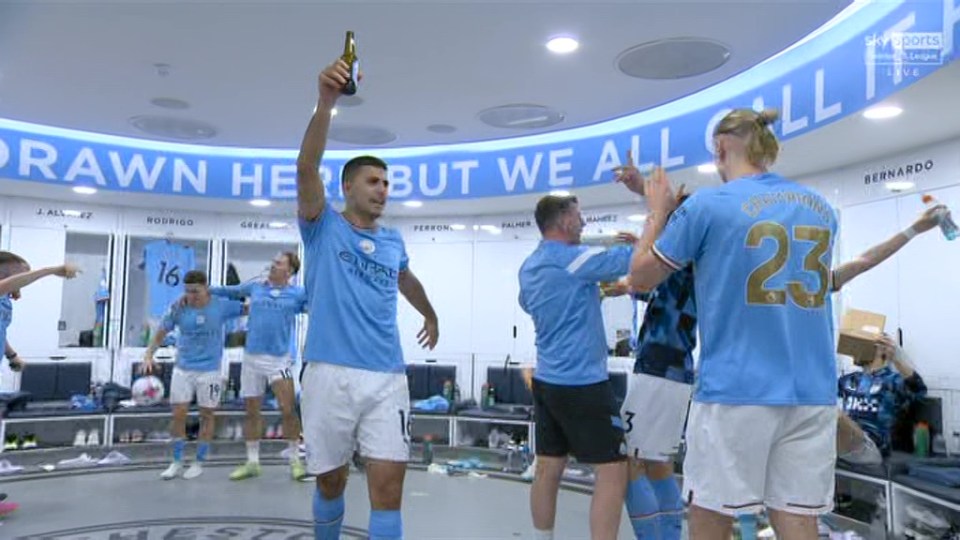 Spain midfielder Rodri raises a beer in triumph after Man City clinched the title