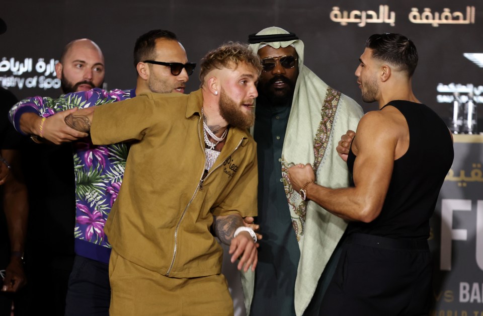 Jake Paul and Tommy Fury with Derek Chisora before their fight