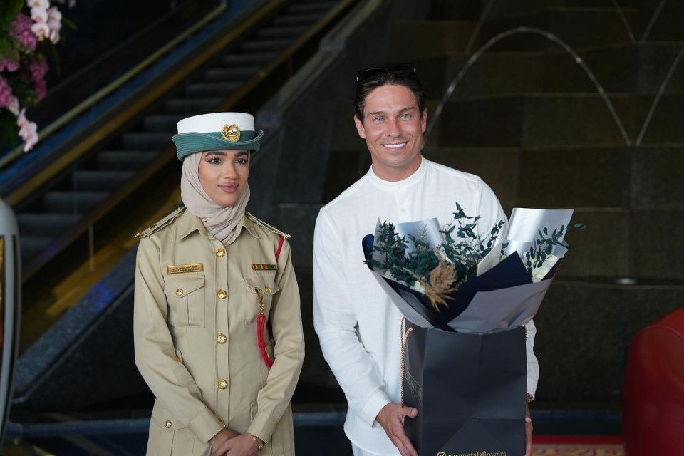 He posed with flowers and an Esaad card after being welcomed to the UAE