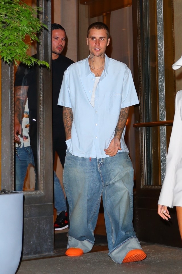 Justin Bieber matched his wife's style in a pale blue shirt and baggy jeans