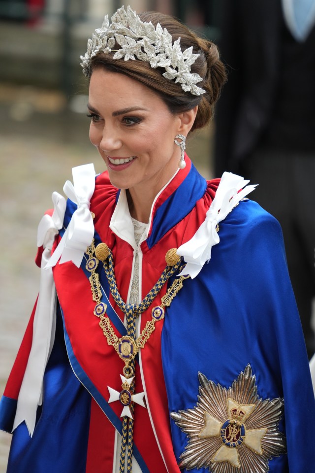 Kate is wearing a dress embroidered with the plants of the four home nations: rose, thistle, daffodil and shamrock